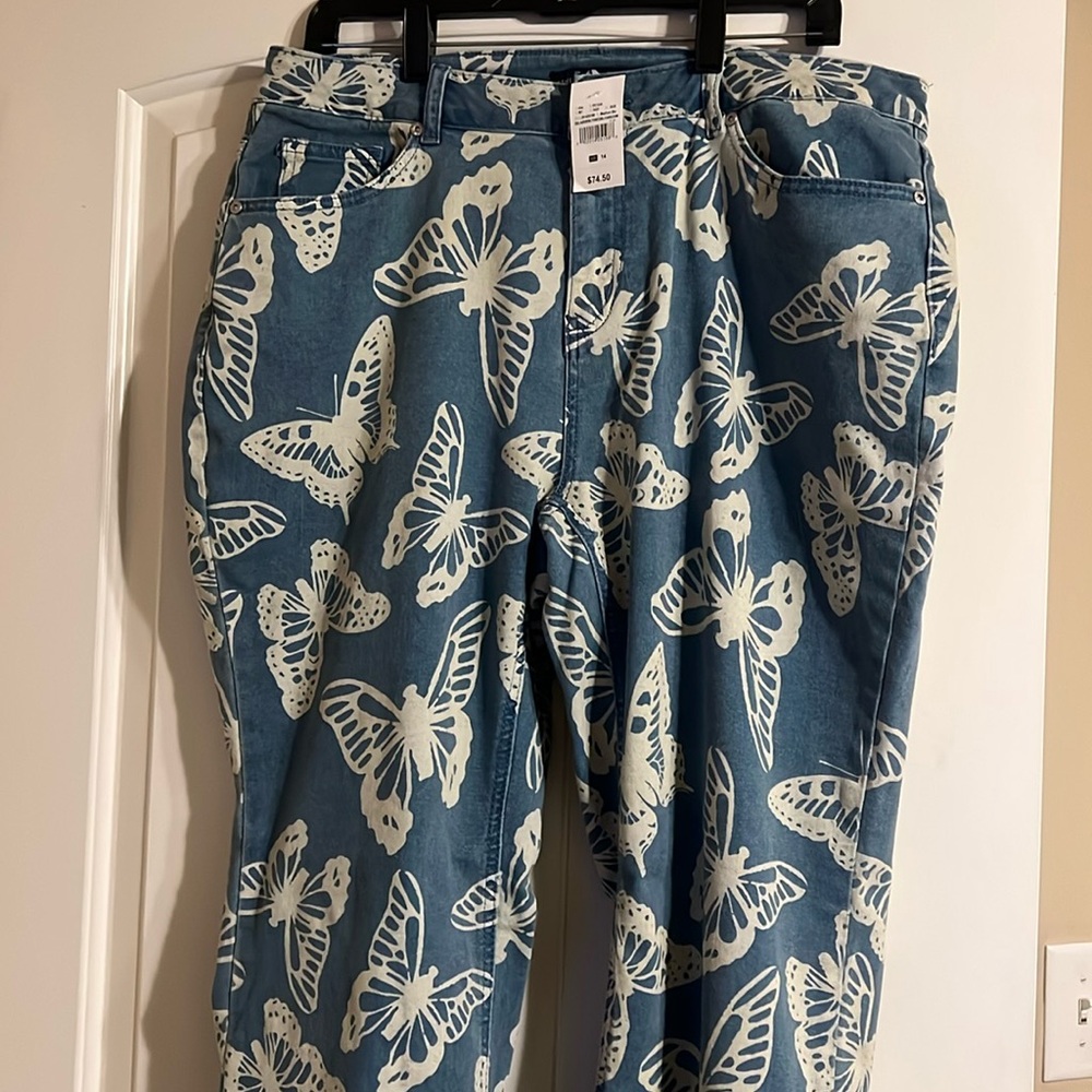 NWT BUTTERFLY PRINT, DENIM FLARE LEG JEANS from a smoke/pet free home.